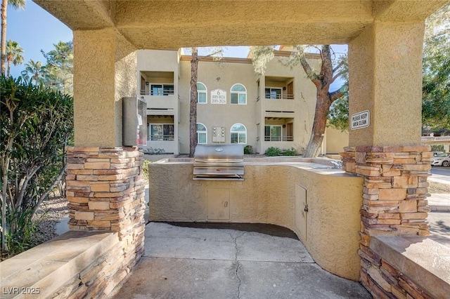 view of patio / terrace with exterior kitchen and area for grilling