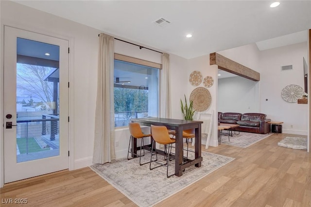 dining space with light wood-type flooring