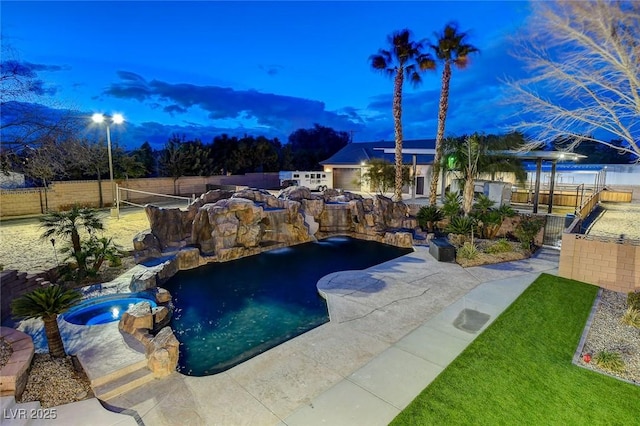 view of pool at dusk