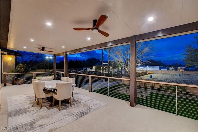 patio terrace at dusk with ceiling fan