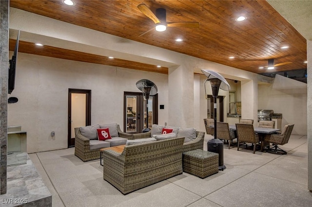 interior space with ceiling fan and an outdoor living space