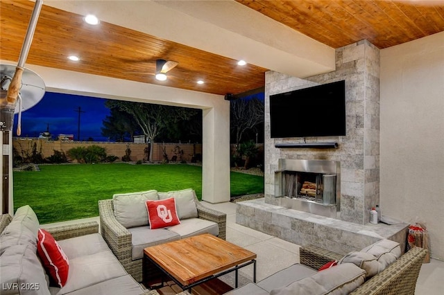 view of patio with an outdoor living space with a fireplace