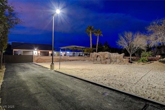 yard at dusk with volleyball court