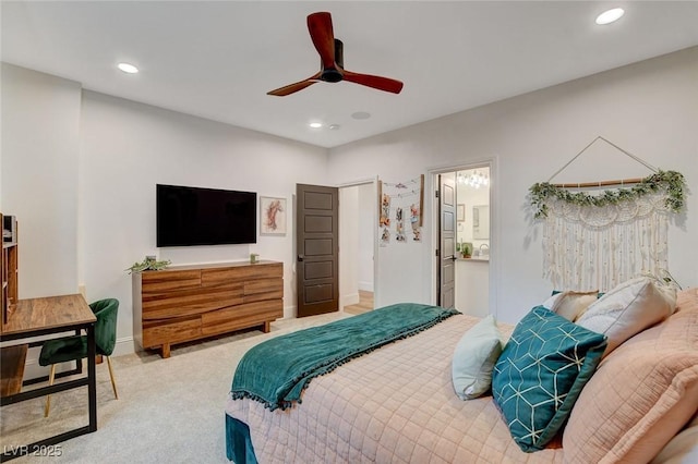 bedroom featuring ensuite bath and ceiling fan