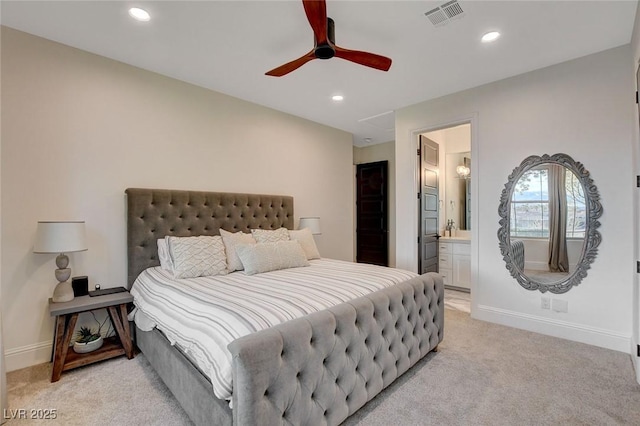 carpeted bedroom with connected bathroom and ceiling fan