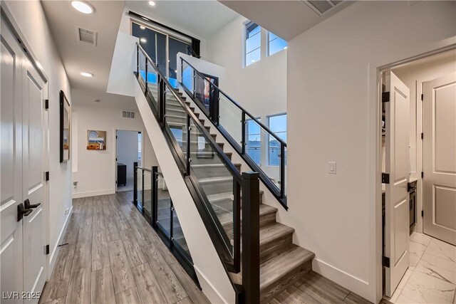 staircase featuring wood-type flooring