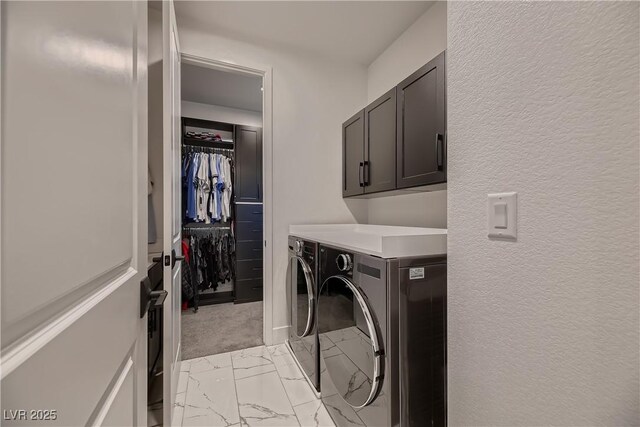 laundry room with cabinets and washing machine and dryer