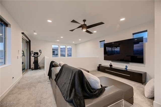 carpeted cinema room featuring ceiling fan