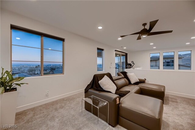 cinema featuring light colored carpet and ceiling fan