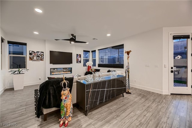 6289 Redstone Hills Dr, Las Vegas, NV 89148 - living area featuring wood finished floors, a ceiling fan, baseboards, and recessed lighting