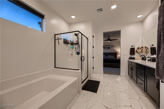 bathroom with ceiling fan, separate shower and tub, and vanity