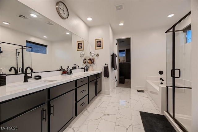 6289 Redstone Hills Dr, Las Vegas, NV 89148 - full bathroom with marble look tiles, a shower stall, double vanity, a bath, and recessed lighting