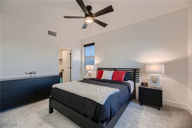 carpeted bedroom with ceiling fan and connected bathroom