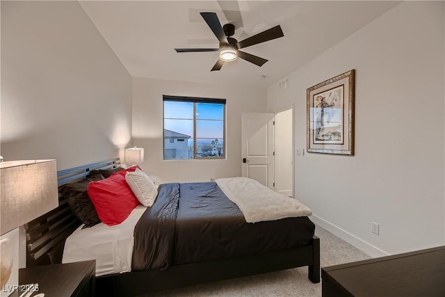 bedroom featuring ceiling fan and carpet