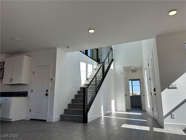 6289 Redstone Hills Dr, Las Vegas, NV 89148 - stairs with wood finished floors, baseboards, and recessed lighting