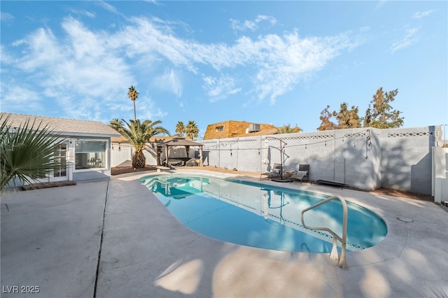 view of swimming pool featuring a gazebo and a patio area