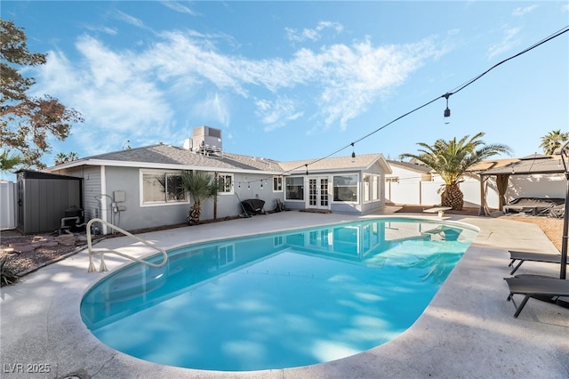 view of pool with central air condition unit, a gazebo, french doors, and a patio