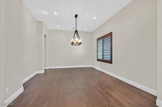 empty room with dark wood-type flooring