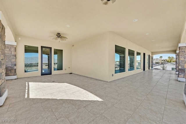 view of patio / terrace featuring ceiling fan