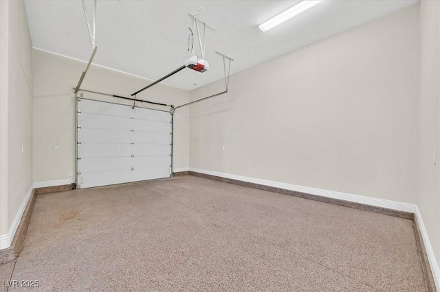 garage featuring baseboards and a garage door opener