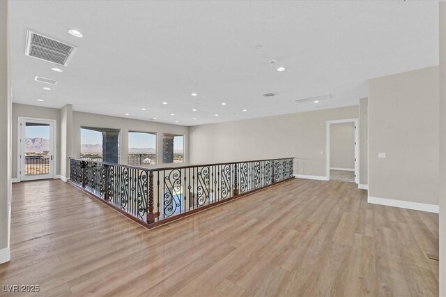 spare room featuring light hardwood / wood-style flooring