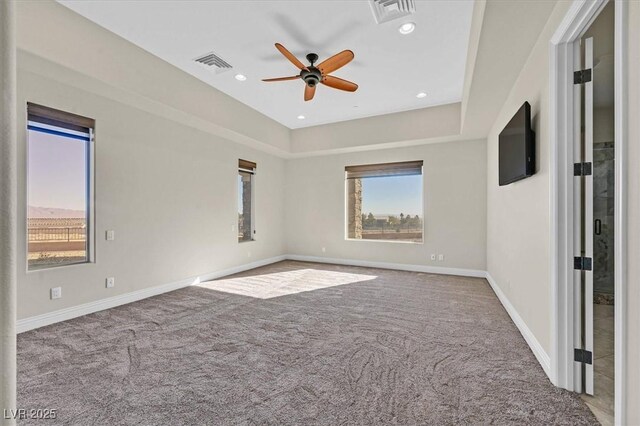 unfurnished room with ceiling fan and carpet floors