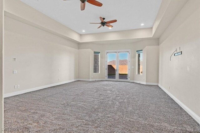 unfurnished living room with ceiling fan and carpet flooring