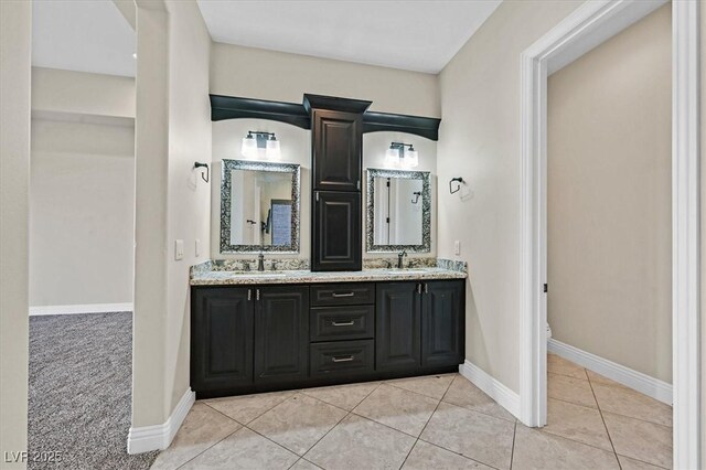 bathroom with toilet, tile patterned flooring, and vanity