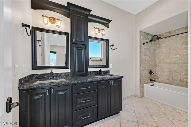 bathroom featuring vanity, tile patterned flooring, and tiled shower / bath combo