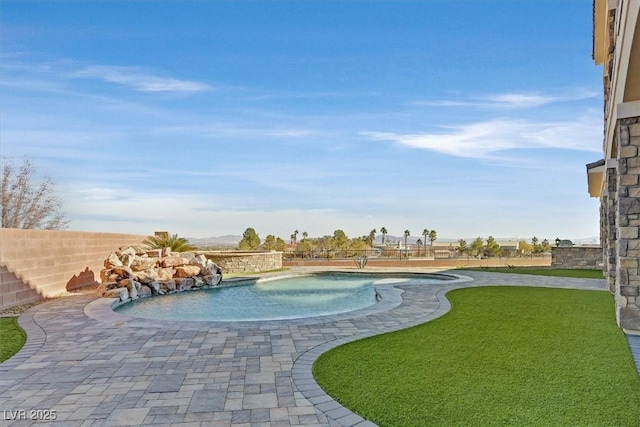 view of swimming pool with a fenced in pool, a patio, a lawn, and fence private yard