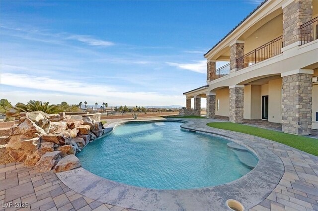 view of swimming pool with a patio