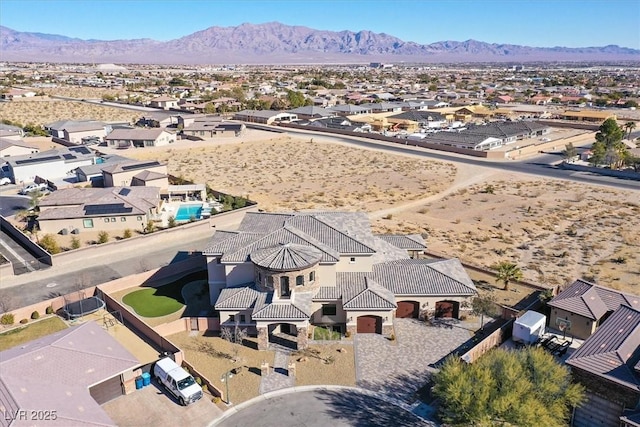 drone / aerial view with a mountain view and a residential view