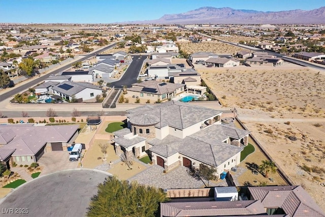 birds eye view of property with a mountain view and a residential view