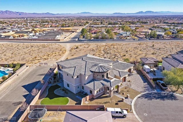 bird's eye view with a desert view, a mountain view, and a residential view