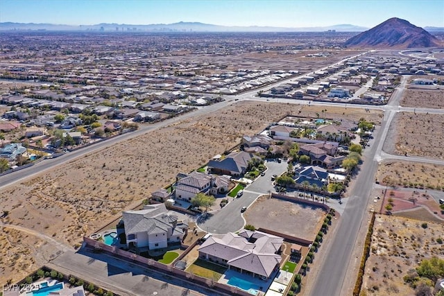 birds eye view of property with a mountain view and a residential view