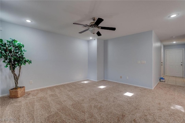 carpeted empty room with ceiling fan