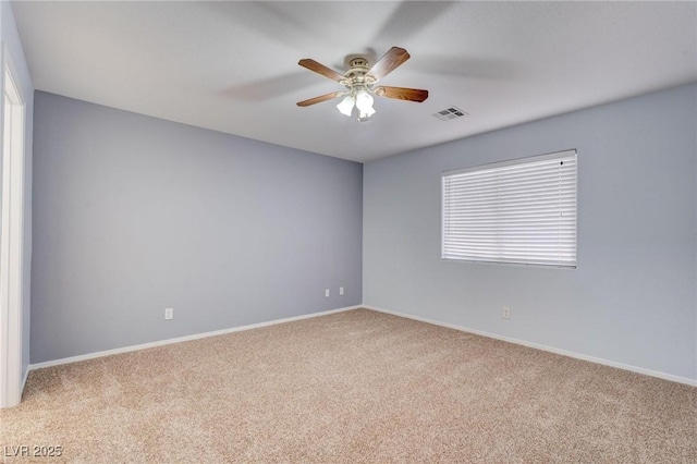 empty room with light carpet and ceiling fan