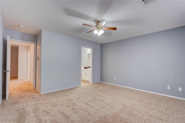 unfurnished room with ceiling fan and light carpet