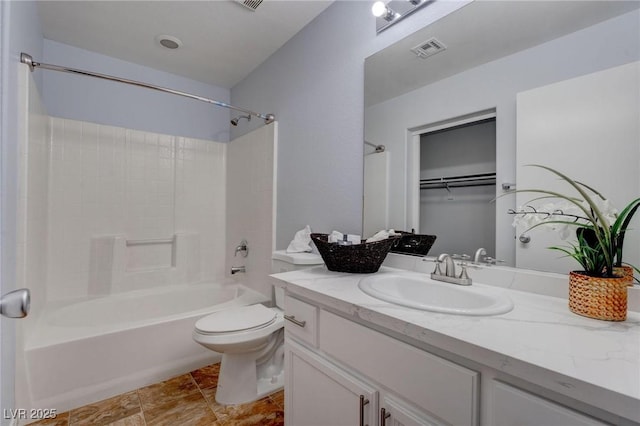 full bathroom with toilet, vanity, and bathing tub / shower combination