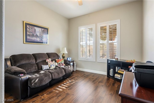 living room featuring ceiling fan and dark hardwood / wood-style flooring