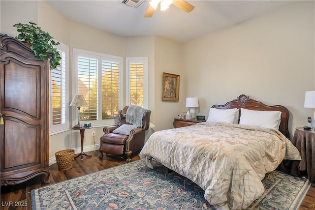 bedroom featuring ceiling fan and dark hardwood / wood-style floors