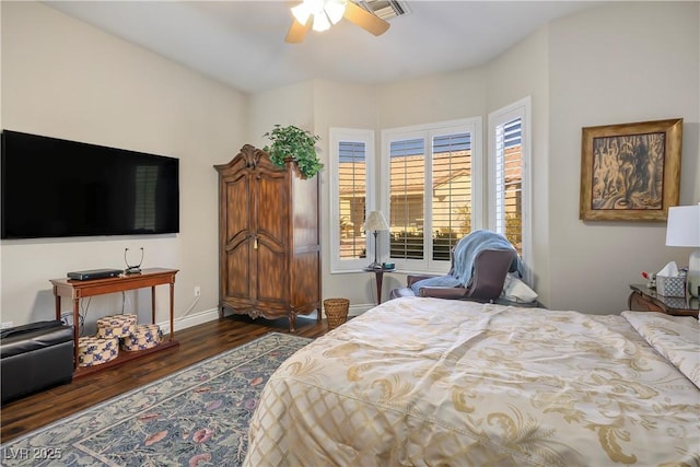 bedroom featuring ceiling fan and dark hardwood / wood-style flooring