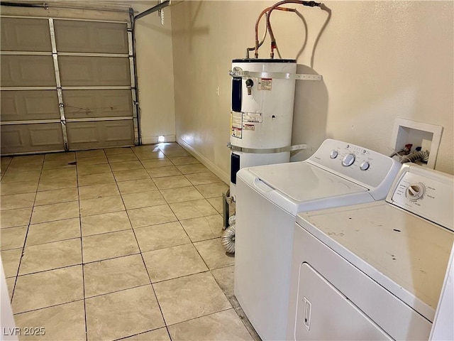 washroom with water heater, washing machine and clothes dryer, and light tile patterned floors