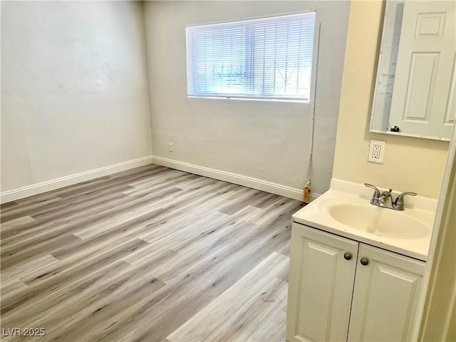 bathroom featuring vanity and hardwood / wood-style flooring