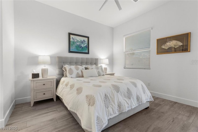 bedroom with ceiling fan and light hardwood / wood-style floors