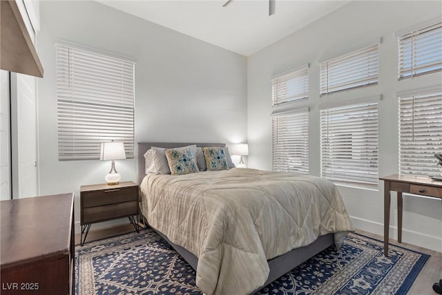 bedroom with ceiling fan and hardwood / wood-style floors