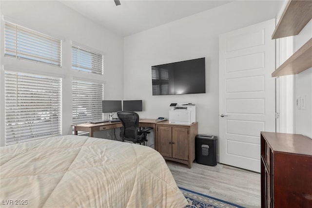 bedroom with ceiling fan and light hardwood / wood-style flooring