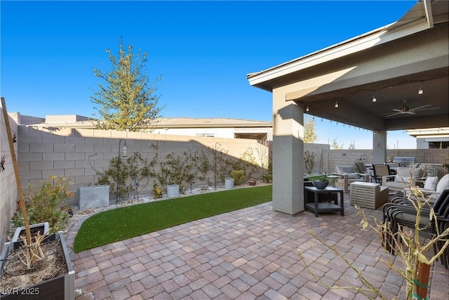 view of patio featuring ceiling fan