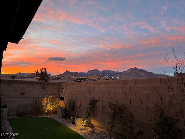 yard at dusk with a mountain view