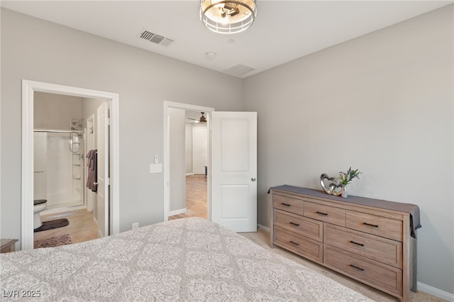 bedroom featuring ensuite bath, a closet, and a spacious closet